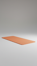 Capture a Tangerine yoga mat at a 3/4 angle on a neutral Cloud Gray backdrop. The mat is perfectly centered with soft,...